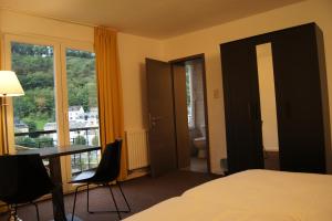 Postel nebo postele na pokoji v ubytování Hotel Bouillon