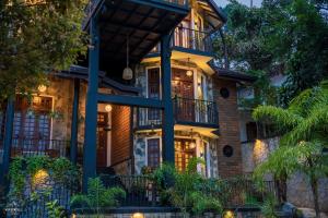 a house with a lit up facade at night at Winterfell Bandarawela in Bandarawela