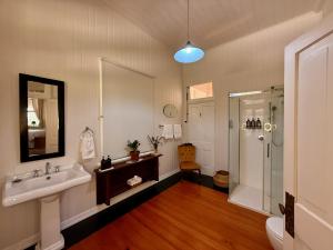 a bathroom with a sink and a shower at Kilkivan Homestead in Kilkivan