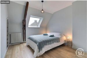 Postel nebo postele na pokoji v ubytování Gite de la Ville aux Bois