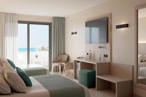 Ένα ή περισσότερα κρεβάτια σε δωμάτιο στο Hotel Best Mojácar