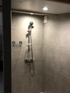 a shower in a bathroom with a shower at yourte Coeur de Combray in Ernes +14 photos