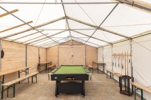 a room with a pool table in a tent at Apartamenty przy winnicach - blisko term - świetny wybór dla rodzin z dziećmi - mówimy po polsku! in Bogács +30 photos