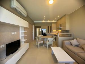 a living room with a couch and a table at 3 bedrooms penthouse with sea view in Hurghada