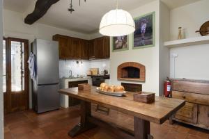 a kitchen with a table with a bowl of food on it at Il Palazzaccio - Tuscan Historical Villa in Reggello in Reggello