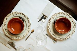 two cups of coffee sitting on top of a table at Hotel Chalet Seggiovia in Pontechianale +14 photos