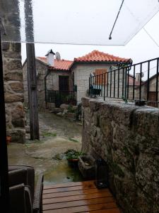 an outside view of a yard with a house at Casa da Fraga in Viana do Castelo +9 photos