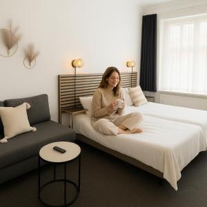 Postel nebo postele na pokoji v ubytování CentralHotellet