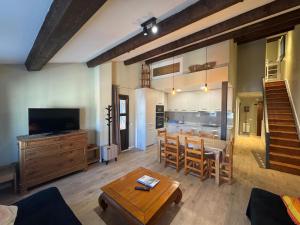 a living room with a kitchen and a dining room at Immodelpas Mundial in Pas de la Casa