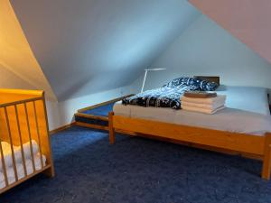 Postel nebo postele na pokoji v ubytování Pension Biofarma Slunečná