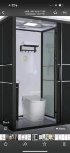 a bathroom with a white toilet in a room at The mirage dome in Bidiyah