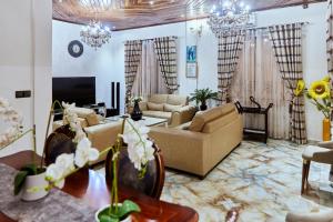 a living room with two couches and a tv at MH - Ground Floor Apart in New Bell