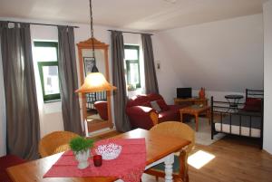 a living room with a table and a couch at Hiddensee in Dargun