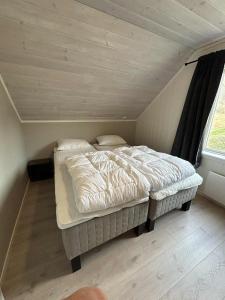 Postel nebo postele na pokoji v ubytování Villa Isfjorden