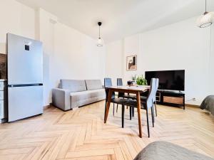 Posezení v ubytování Apartamenty Kamienica Centrum - 1 Maja + 10 fotografií