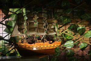 a model ship hanging on a wall at BLK villa-Don's Place - Bliss Lavish Kandy in Kandy