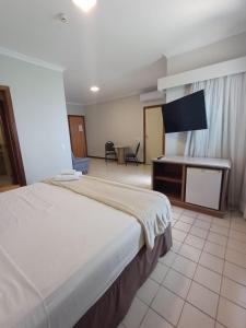 En eller flere senge i et værelse på Recife Mar Flat - 1708