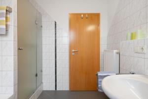 Koupelna v ubytování Mühlerain + 25 fotografií