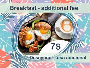 a plate of food with eggs and vegetables and a cup of coffee at Condo very close beach in Punta Cana