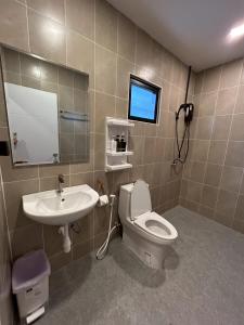 a bathroom with a toilet and a sink at Coco Valley Koh Tao in Ko Tao +62 photos