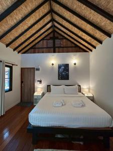Ένα ή περισσότερα κρεβάτια σε δωμάτιο στο Coco Valley Koh Tao