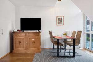 TV a/nebo společenská místnost v ubytování Mühlerain