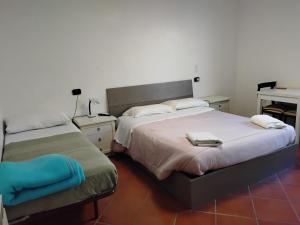 Ένα ή περισσότερα κρεβάτια σε δωμάτιο στο Casa di Cinzia