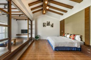 Ένα ή περισσότερα κρεβάτια σε δωμάτιο στο 迦那會館