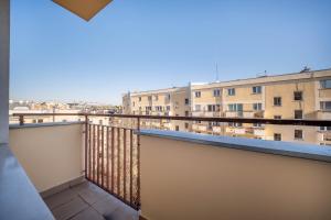 a balcony with a view of some buildings at Żurawia Mini Apartments by Sofija in Warsaw