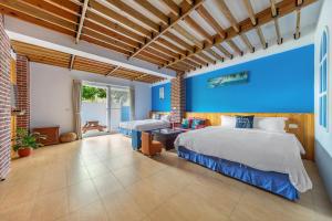 Postel nebo postele na pokoji v ubytování 迦那會館