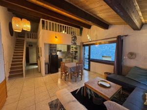 a living room with a couch and a table at Immodelpas Mundial in Pas de la Casa