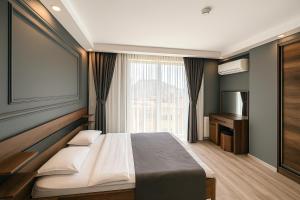 Postel nebo postele na pokoji v ubytování On4 Rooms & Suites