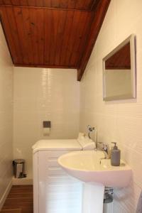 a bathroom with a sink and a mirror at Chez memene in Valdeblore +24 photos