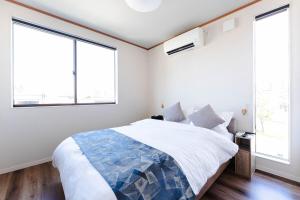 Ένα ή περισσότερα κρεβάτια σε δωμάτιο στο Dokoboko inn西本町