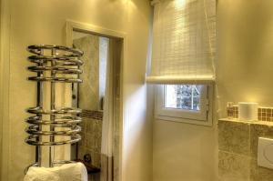 a towel rack in a bathroom with a mirror at L'aire in Lantosque +29 photos