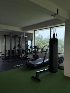 a gym with a punching bag hanging in a room at Turiya Retreat in Auroville