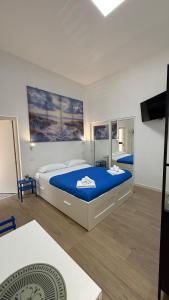 Postel nebo postele na pokoji v ubytování Blu Mediterraneo