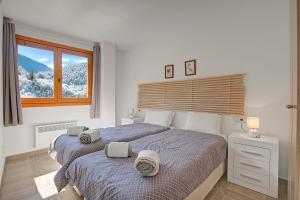 Кровать или кровати в номере Andorra Friends' Ski Apartment - Happy Rentals