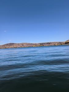 a view of a large body of water at Mary Titicaca lodge uros in Puno +4 photos