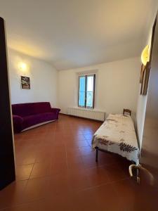 Postel nebo postele na pokoji v ubytování Molinella Appartamento Amelia & Carlo