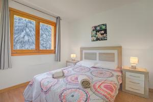 Giường trong phòng chung tại El Tarter Mountain Ski Vacation Rental - Happy Rentals