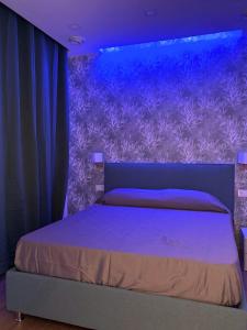 Ένα ή περισσότερα κρεβάτια σε δωμάτιο στο La Dimora del mare - Cozy & Relax - 800m dal mare