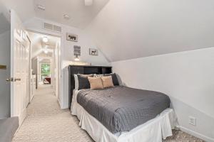 a bedroom with a bed in a white room at Relax & Explore Waterfront Crawford Lake Cottage 4878 in Darragh