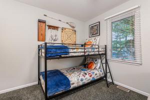 a bedroom with two bunk beds in a room at Relax & Explore Waterfront Crawford Lake Cottage 4878 in Darragh +81 photos