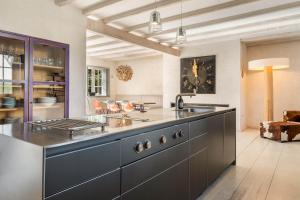 a kitchen with a large counter top with a sink at Lighthouse 2 in Hörnum