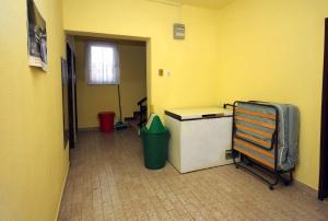 an empty room with a desk and a trash can at Double Room Podaca 2613b in Podaca