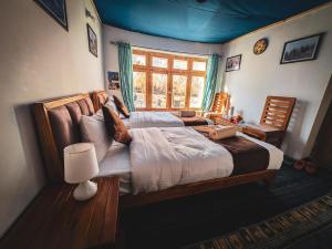 Ένα ή περισσότερα κρεβάτια σε δωμάτιο στο Siachen Eco Residence