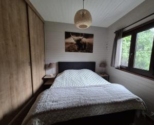 Ένα ή περισσότερα κρεβάτια σε δωμάτιο στο Durbuy - Chalet 4 personen