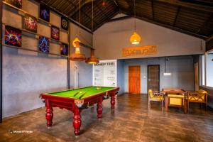 a billiard room with a pool table in it at Monkey Tribe Munnar in Munnar +29 photos