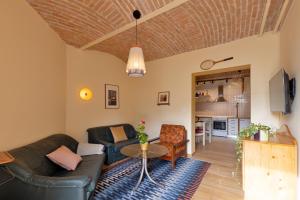 a living room with a couch and a table at Apartment Arc 23 in Celje